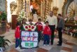 EL CONCEJAL DE DEPORTES ACOMPAÑA A MÁS DE 220 NIÑOS Y AL CUERPO TÉCNICO Y DIRECTIVO DE LA ESCUELA MUNICIPAL DE FÚTBOL EN LA TRADICIONAL OFRENDA FLORAL A LA PATRONA DE LA LOCALIDAD SANTA EULALIA - Foto 36